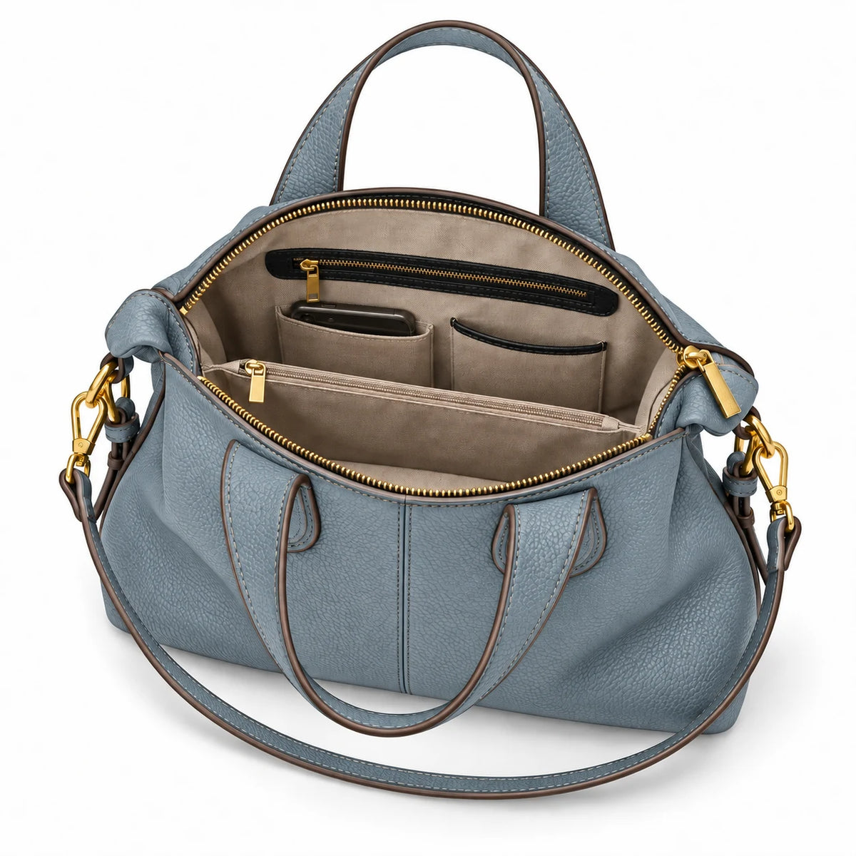 Interior organizado da bolsa feminina de couro azul